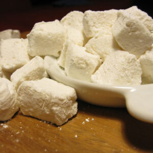 Image of handcut homemade white marshmallows in a white bowl.
